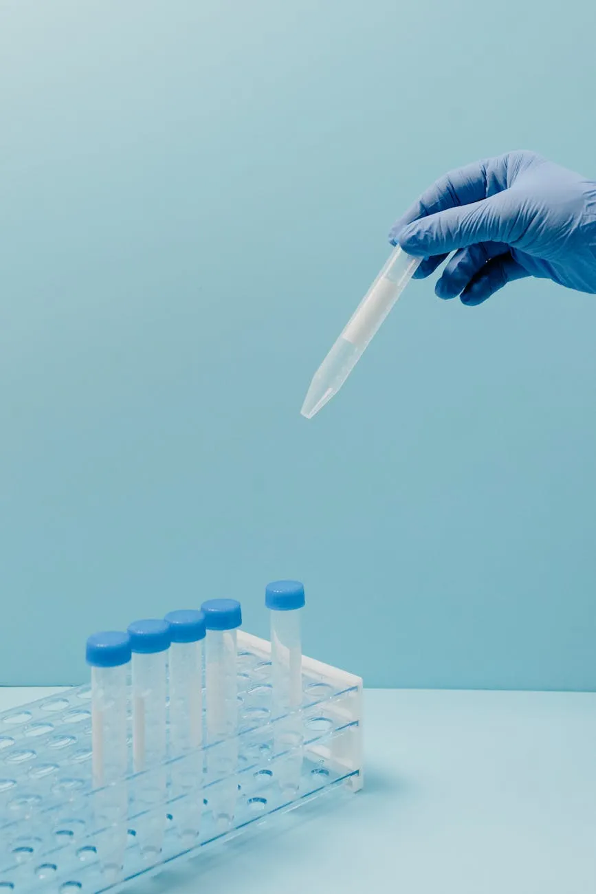 A person holding a sample tube