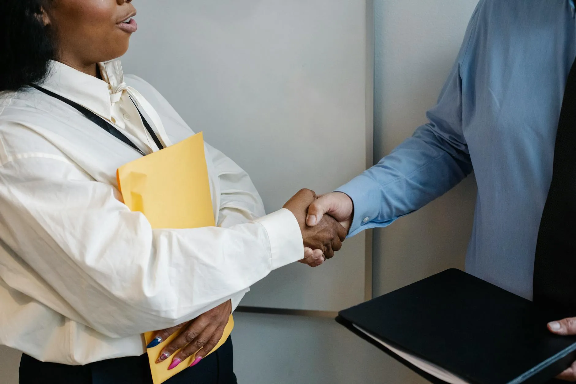 Colleagues shaking hands after a meeting