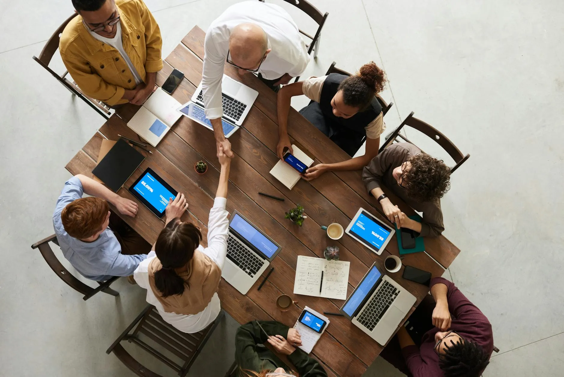 Colleagues shaking hands in a workplace setting